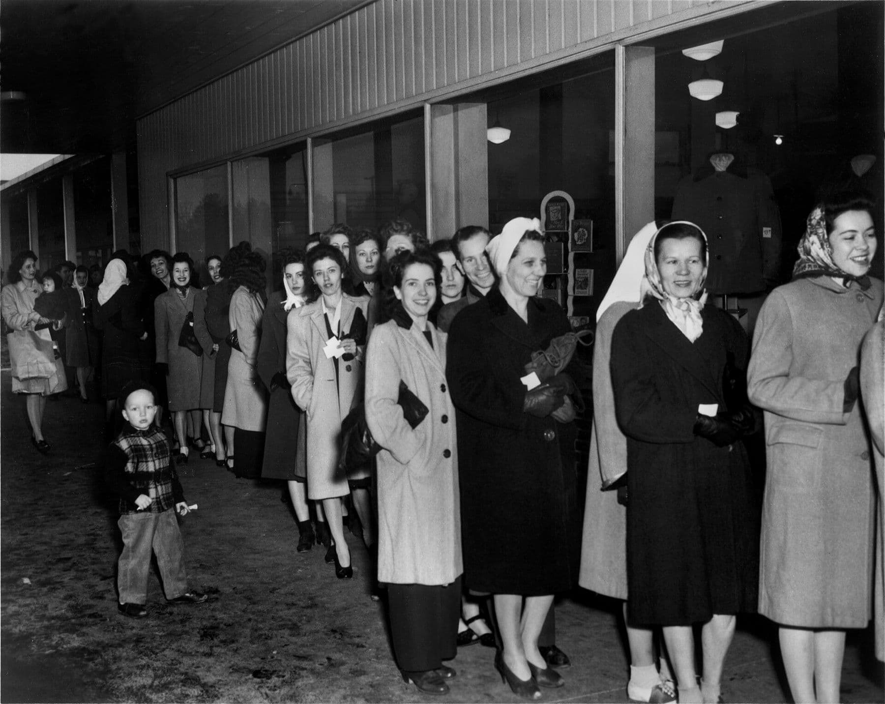 A long queue of women outside a department store in Oak Ridge, Tennessee, waiting for nylon stockings, January 1946